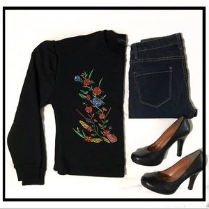 Black sweatshirt with floral design. Size Small